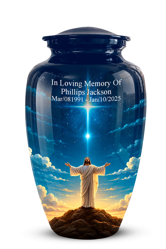A glossy dark blue memorial urn with a lid, featuring a printed design of Jesus standing on a hill with arms outstretched under a starburst and clouds. White personalized text is printed on the upper front.
