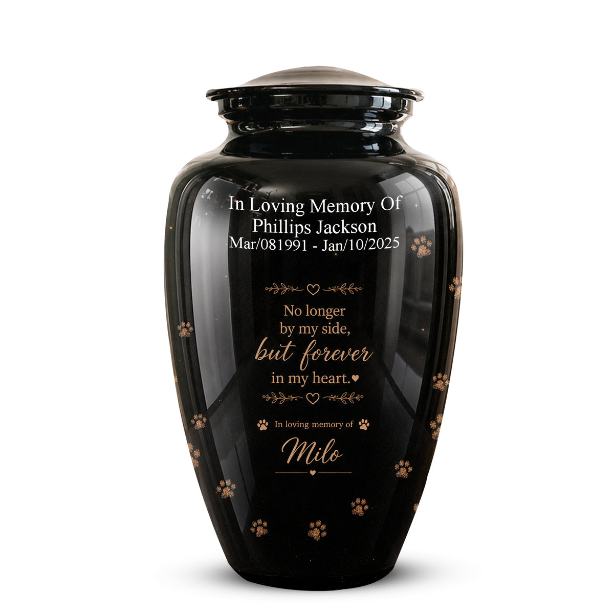 A glossy black pet memorial urn with a matching lid, featuring personalized white and gold text and small paw print details, shown on a clean white background.