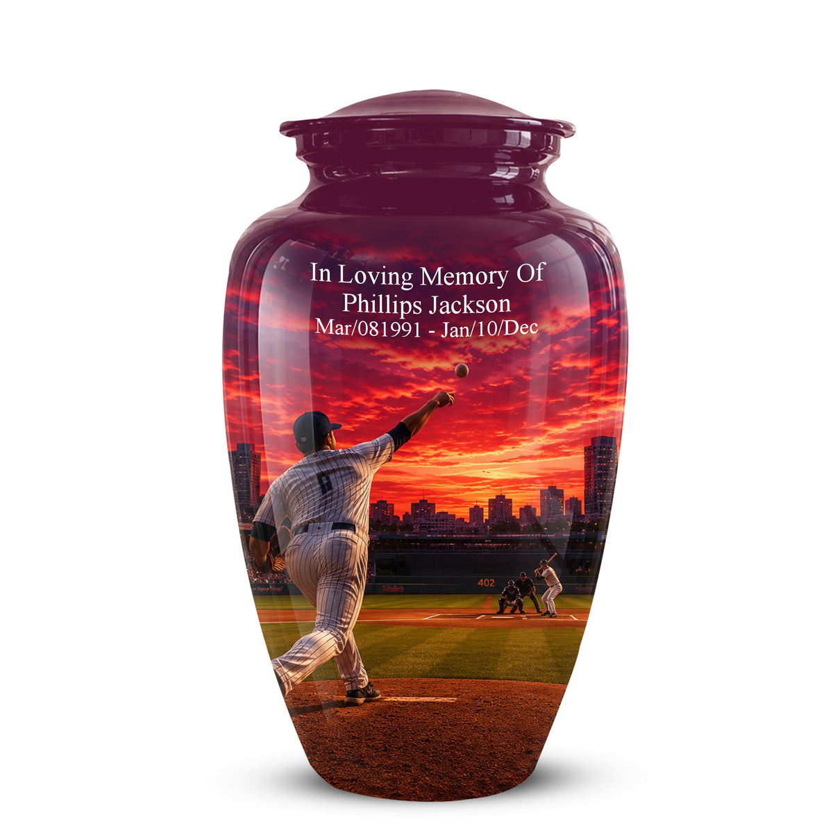 A glossy urn-shaped memorial vase with a dark burgundy lid and base, featuring a printed baseball field scene at sunset with a pitcher and the text 'In Loving Memory Of Phillips Jackson Mar/08/1991 - Jan/10/Dec' on the front, shown on a white background.