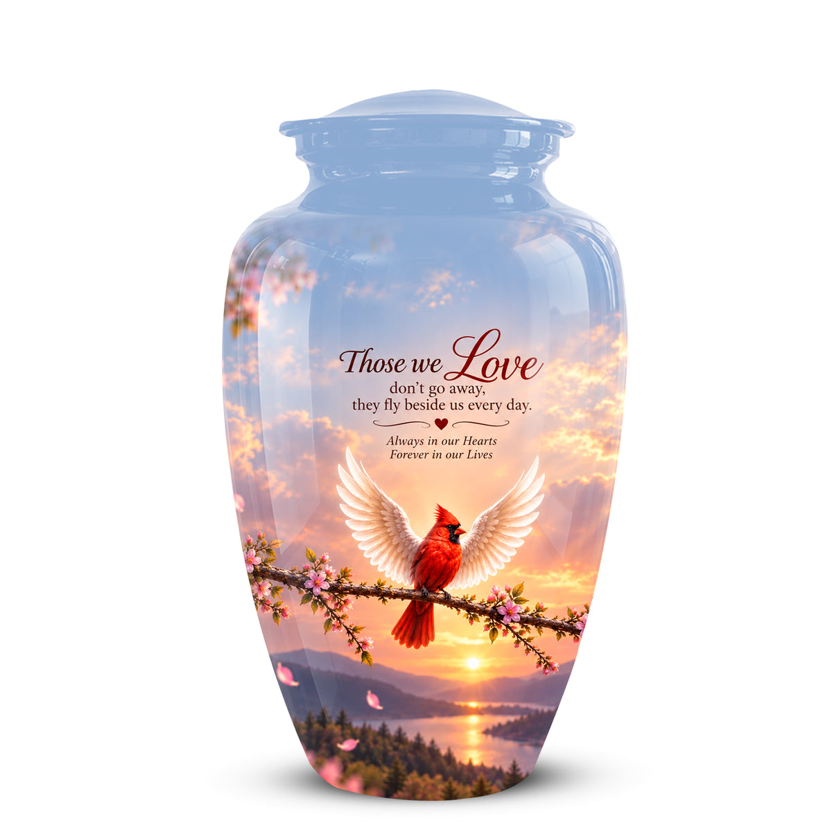 A glossy glass cremation urn with a lid, decorated with a scenic sunset landscape, a red cardinal, and white wings, with the printed text 'Those we Love don't go away, they Fly beside us every day. Always in our Hearts Forever in our Lives'.