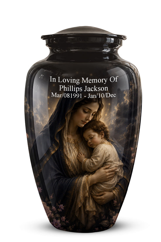 A glossy black cremation urn with a lid, featuring a printed memorial design of a mother holding a child against a cloudy sky. White personalized text is printed on the front: 'In Loving Memory Of Phillips Jackson Mar/08/1991 - Jan/10/Dec'.