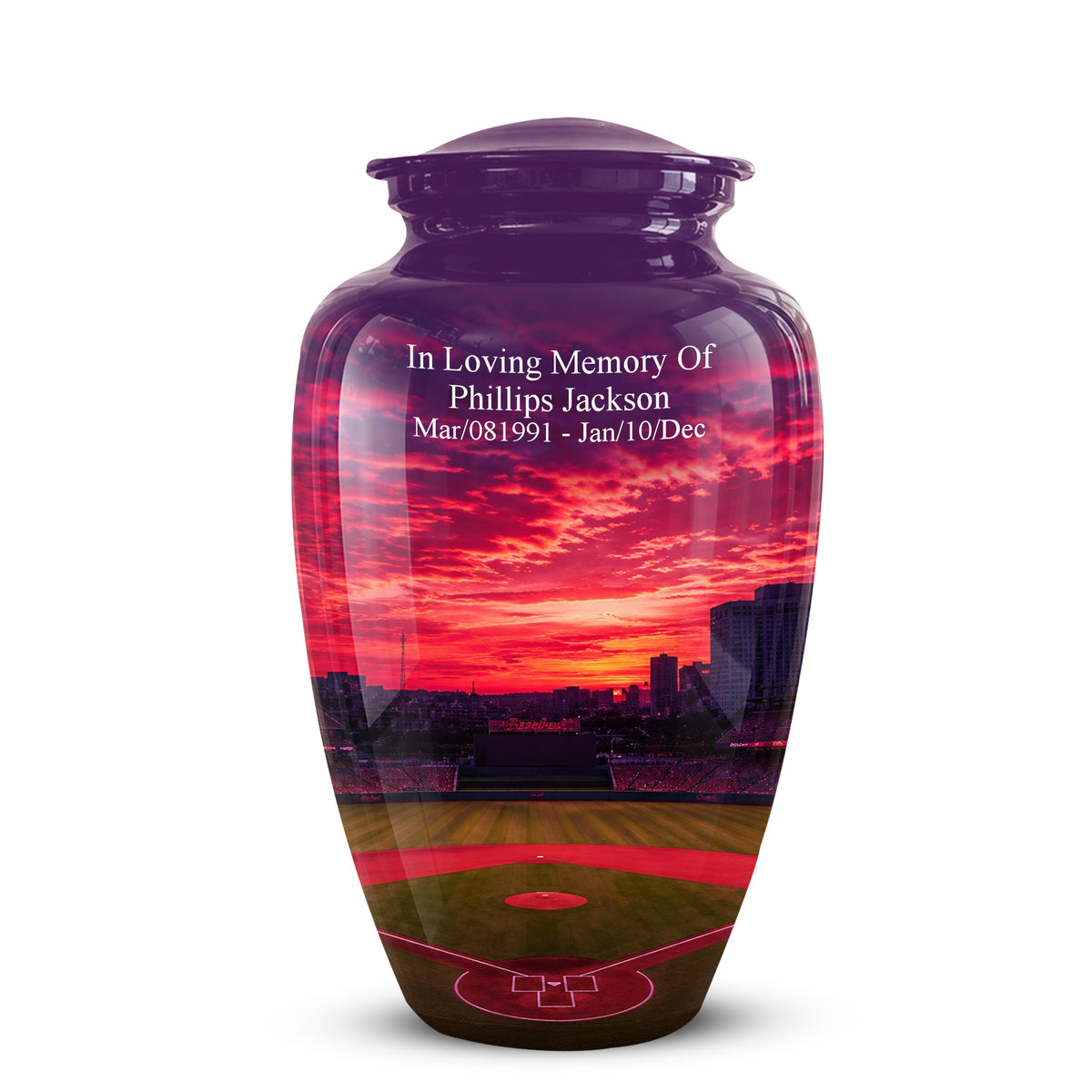 A glossy ceramic cremation urn with a custom printed baseball field sunset design and white memorial text on the front, shown on a plain white background.