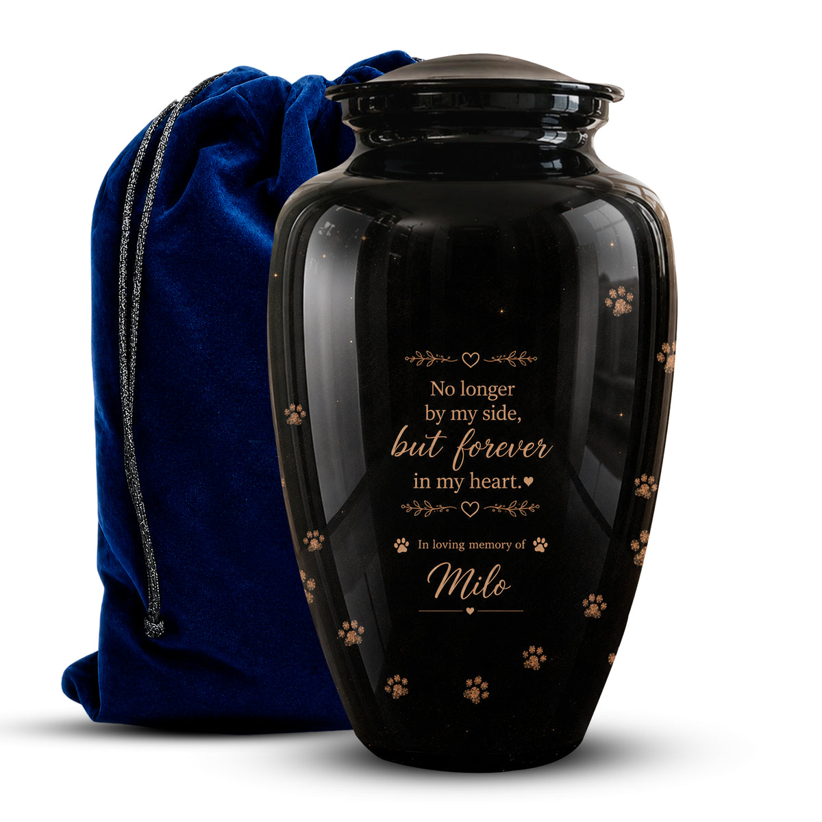 A glossy black pet memorial urn with gold engraved text and paw print details, shown next to a royal blue velvet drawstring bag on a white background.