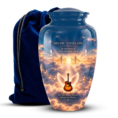 A personalized glass cremation urn with a blue glass lid and base, featuring a printed sunset sky design with an angel guitar, wings, and the text 'MUSIC LIVES ON'. A dark blue velvet drawstring bag sits behind it on a white background.