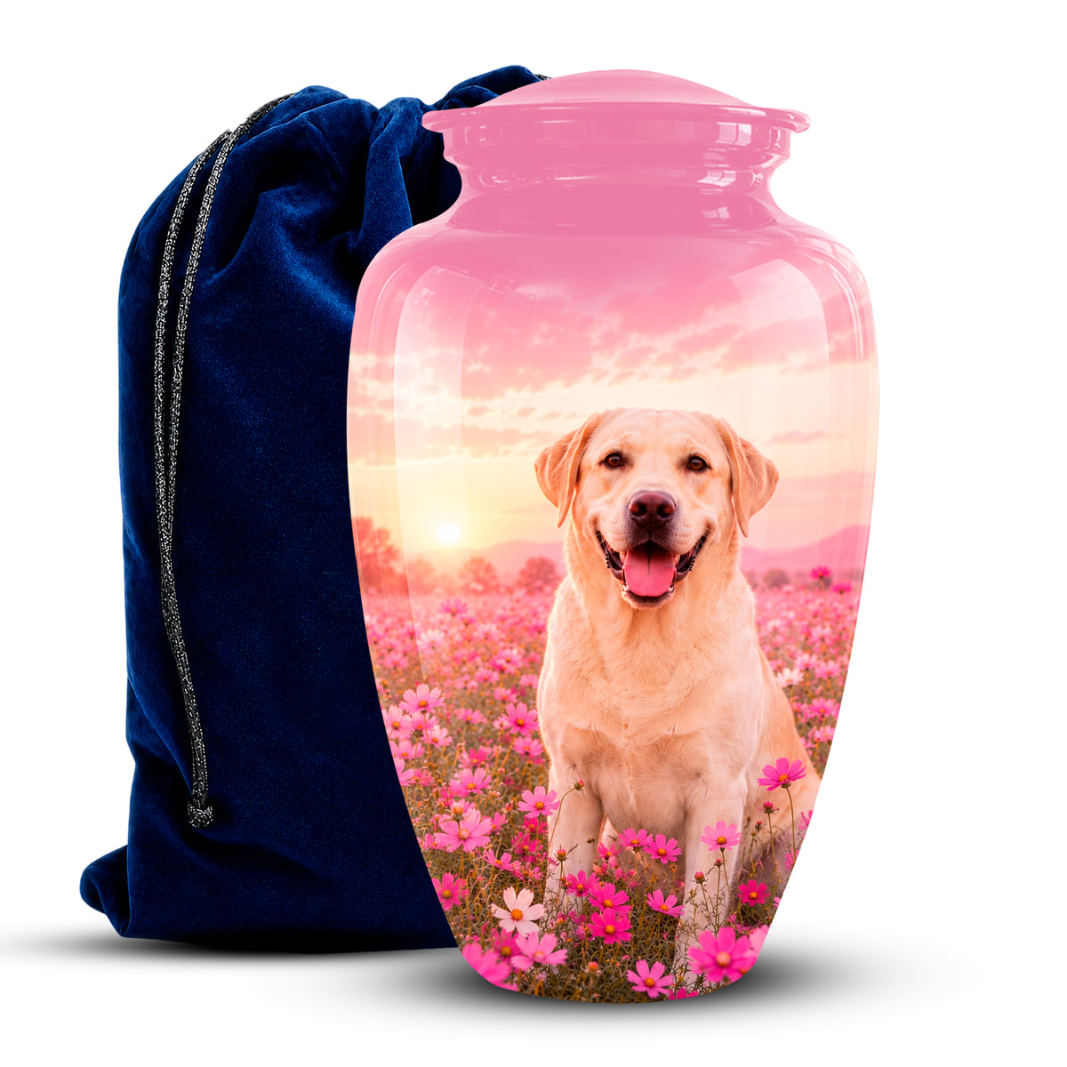 A pink glass pet memorial urn with a custom printed photo of a yellow Labrador retriever sitting in a field of pink flowers at sunset, shown next to a dark blue velvet drawstring bag on a white background.