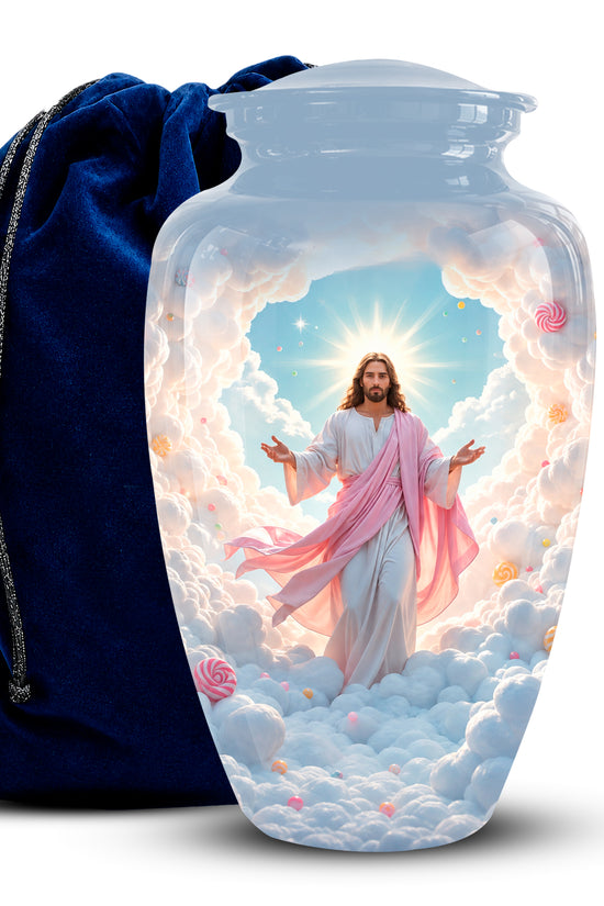 A clear glass cremation urn with a lid, featuring a printed image of Jesus standing in clouds with a radiant halo. A dark blue velvet drawstring bag is positioned behind the urn on a white background.