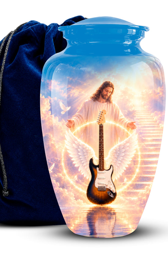 A glossy blue urn-shaped keepsake or cremation urn with a printed spiritual scene of Jesus with angel wings and a guitar, shown in front of a dark blue velvet drawstring bag on a white background.