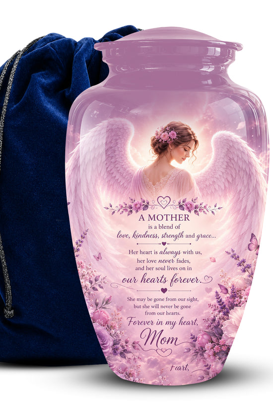 A pink translucent keepsake urn with a printed angel and lavender floral design, shown with a dark blue velvet drawstring bag on a white background.