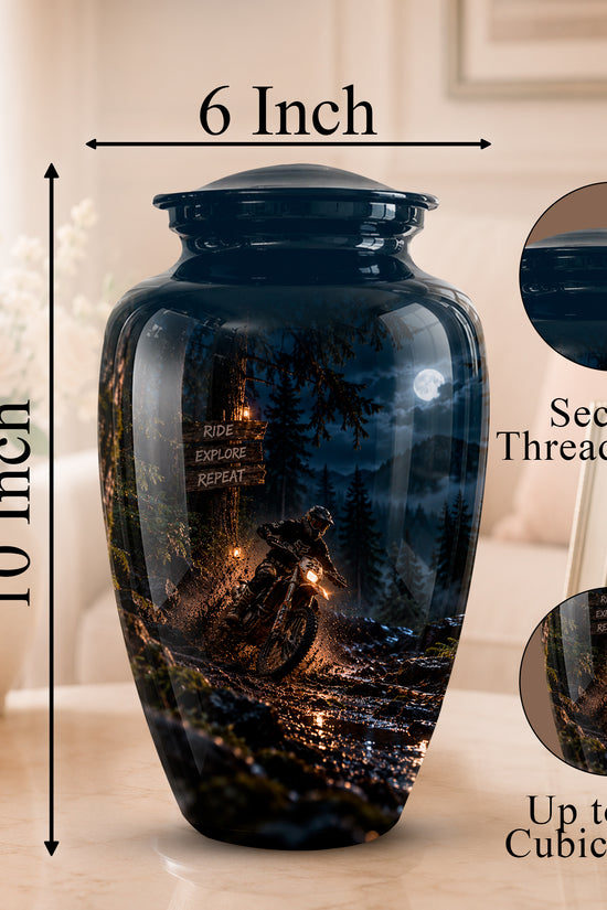 A dark blue memorial urn with a printed night landscape design, shown on a tabletop with dimension arrows indicating 10 inch height and 6 inch width. Two circular inset close-ups show the secure threaded lid and the printed detail, with text noting up to 200 cubic inches.