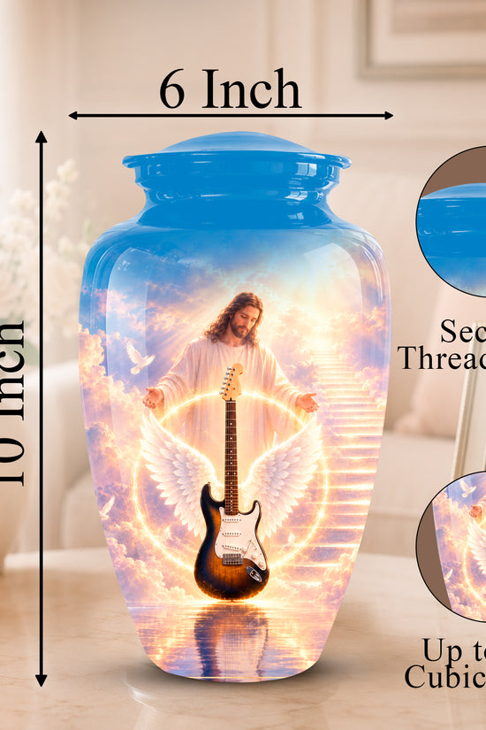 A decorative ceramic urn with a blue threaded lid, featuring a printed graphic of Jesus with angel wings and a guitar on a glowing staircase. The image includes dimension labels showing 10 inch height and 6 inch width, plus circular insets highlighting the secure threaded lid and the printed design.