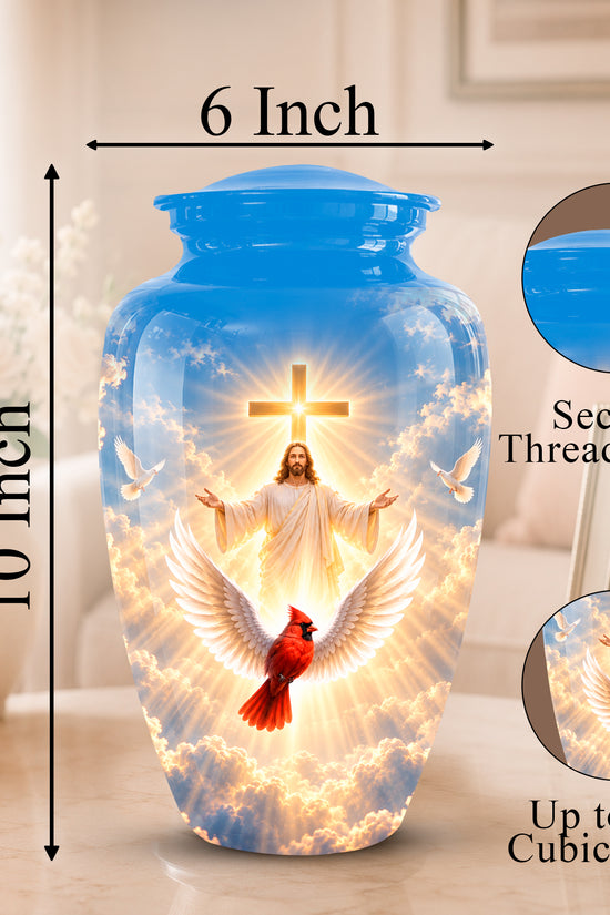 A blue ceramic cremation urn with a printed religious design of Jesus with outstretched arms, white doves, clouds, and a red cardinal. The image includes dimension labels showing 10 inch height and 6 inch width, plus circular insets showing the secure threaded lid and the printed design detail.