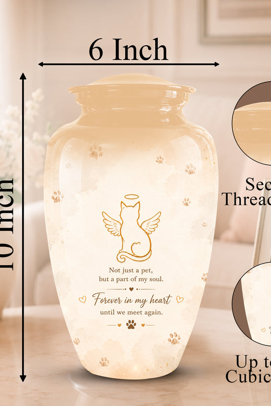 A cremation urn vase with a threaded lid, shown with dimension labels indicating 10 inches tall by 6 inches wide. The vase is warm cream/beige with a printed angel cat design and memorial text.