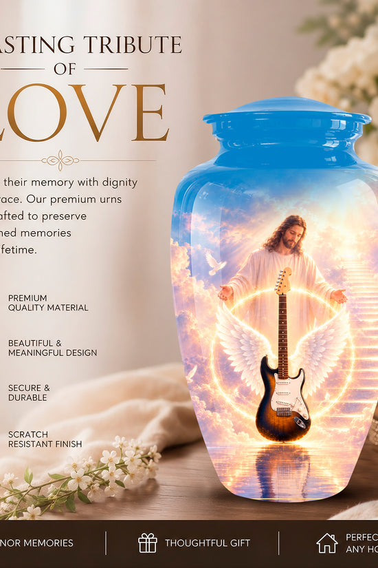 A memorial urn jar with a blue lid and glowing interior artwork of Jesus with angel wings and a guitar, shown on a tabletop with flowers, candles, and promotional text reading 'A LASTING TRIBUTE OF LOVE'.