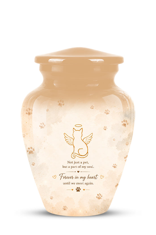 A glossy ceramic pet memorial urn in a warm cream and beige color, decorated with a gold angel cat illustration, paw prints, and a sentimental quote on the front.