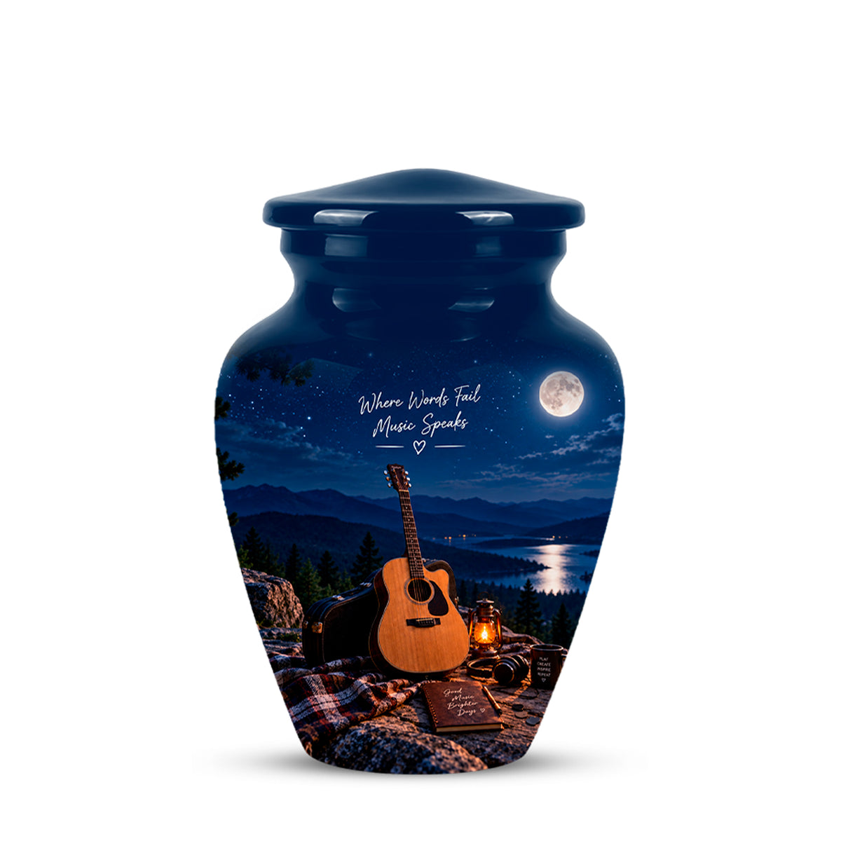 A dark blue urn-shaped vase with a lid, featuring a printed scenic graphic of a night campsite with an acoustic guitar, lantern, mountains, lake, moon, and the words 'Where Words Fail Music Speaks'.