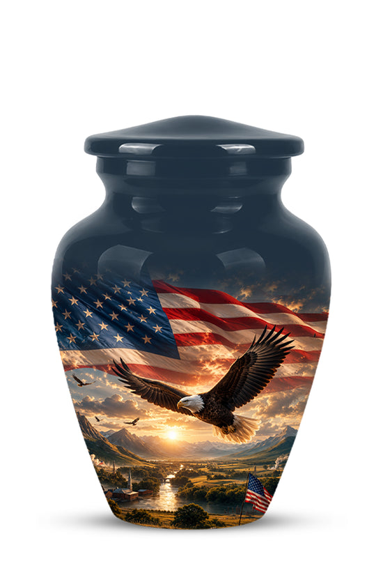 A glossy black urn with a lid, featuring a printed patriotic design of a bald eagle flying over a scenic American landscape with an American flag and sunset sky.