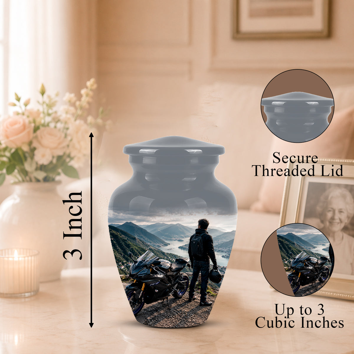 A memorial urn vase with a printed scenic photo of a motorcyclist on a mountain road, shown on a tabletop in a softly lit room. The image includes a 3-inch height marker, a close-up inset labeled 'Secure Threaded Lid,' and a circular inset labeled 'Up to 3 Cubic Inches.