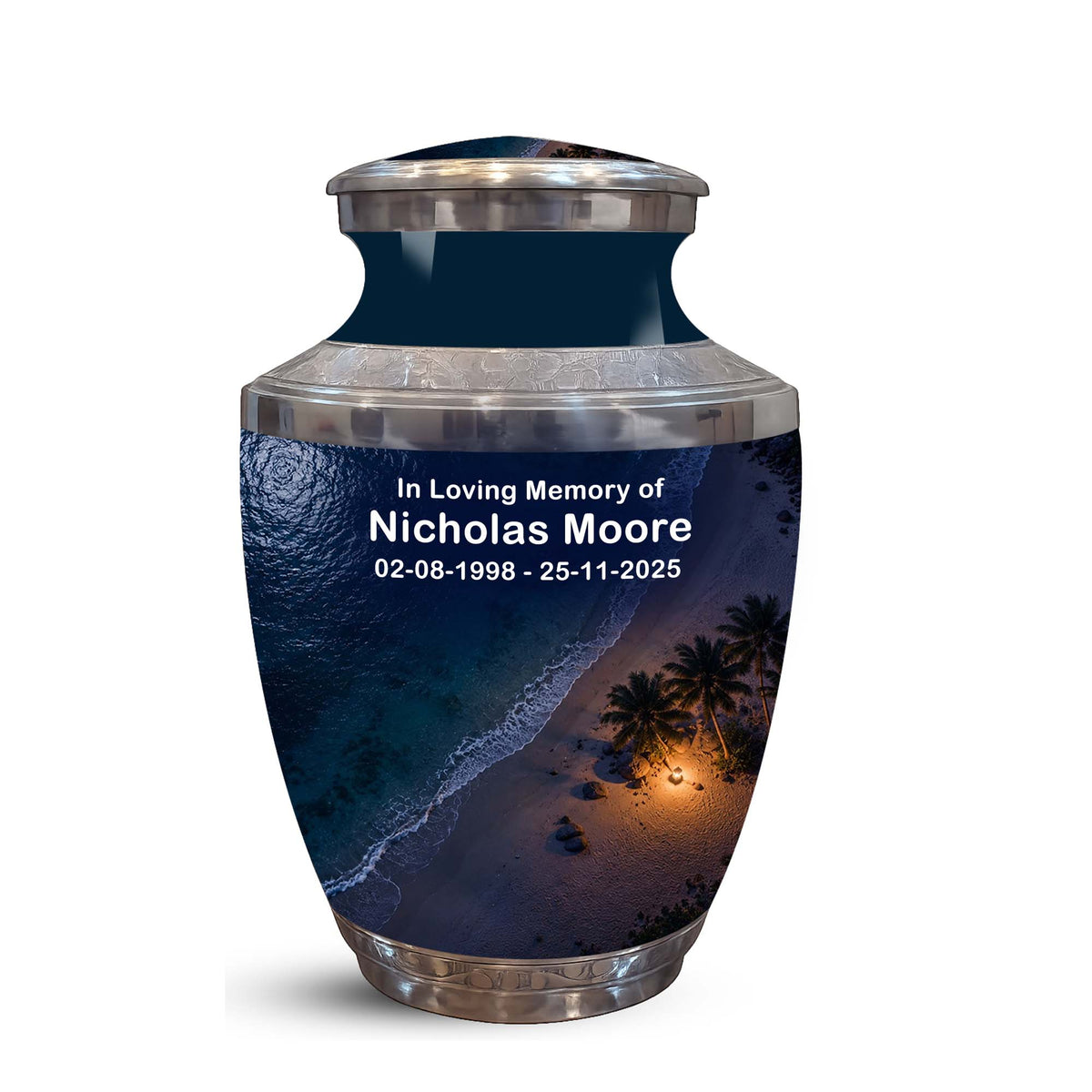 Personalized stainless steel cremation urn with a dark navy blue tropical beach print and silver metallic accents, featuring custom text 'In Loving Memory of Nicholas Moore' on the front.