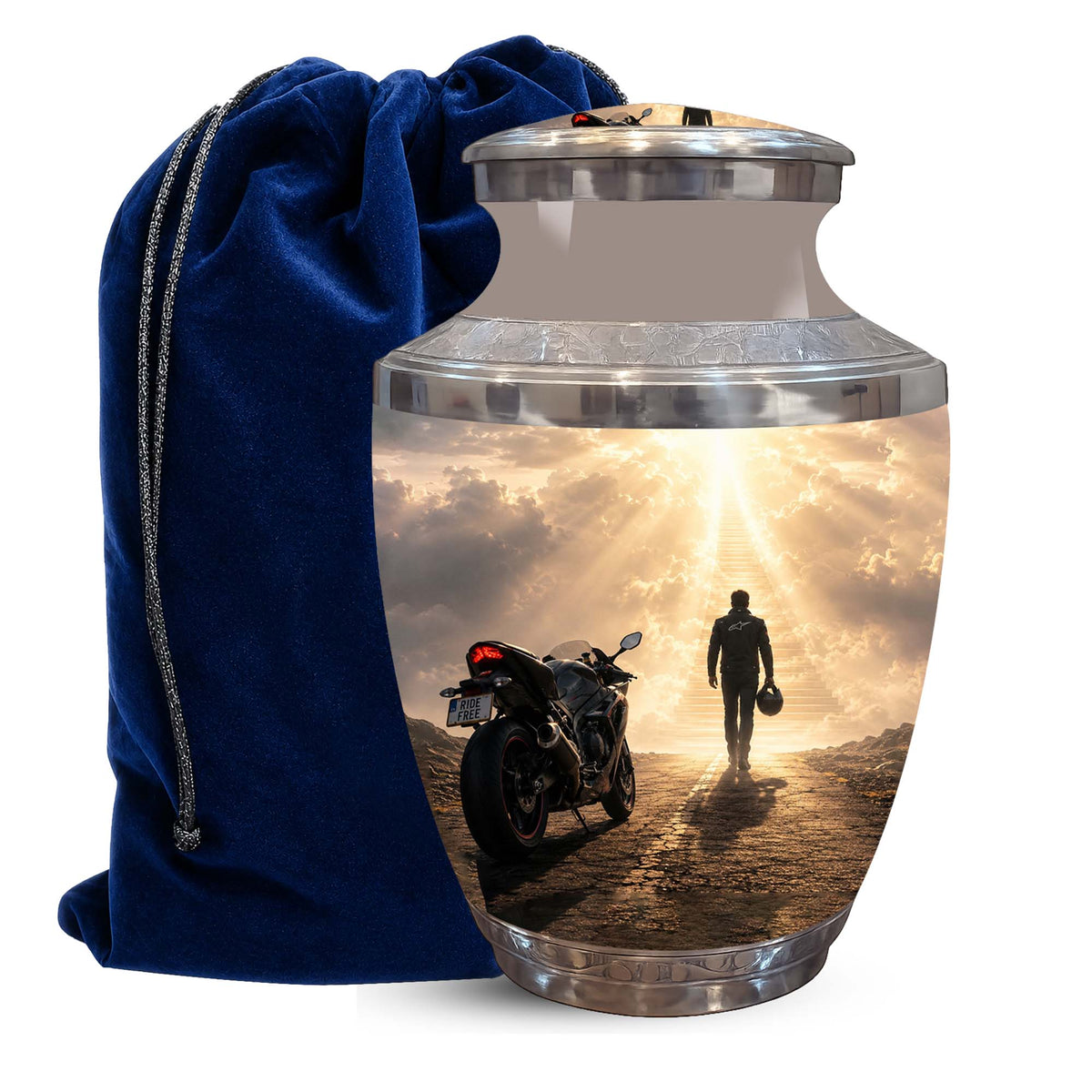 A metallic cremation urn with a custom printed photo of a motorcycle and a person walking toward a bright sky, shown next to a dark blue velvet drawstring bag on a white background.