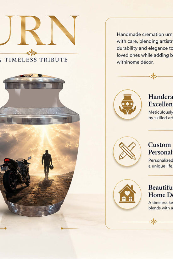 A cremation urn with a printed scenic design of a motorcycle and a walking figure under a bright sky, shown on a beige promotional background with text describing features and dimensions.