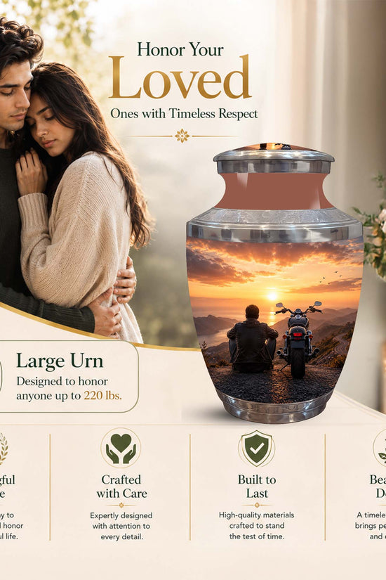 Large cremation urn displayed in a warm memorial-style setting with a couple in the background and text callouts. The urn is shown with a sunset mountain scene and a motorcycle inside, and the image includes marketing text such as 'Honor Your Loved Ones with Timeless Respect' and 'Large Urn Designed to honor anyone up to 220 lbs.