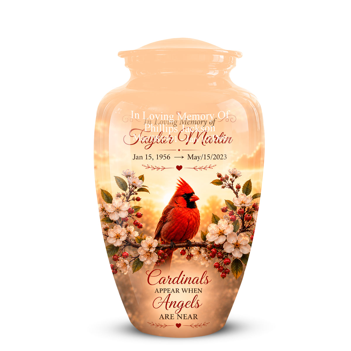 Personalized peach-colored ceramic cremation urn with a printed design of a red cardinal perched on a flowering branch against a warm sunset sky. The front features customizable text for a memorial service.